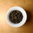 A top-side view of a Jing Shuan tea in a Gaiwan